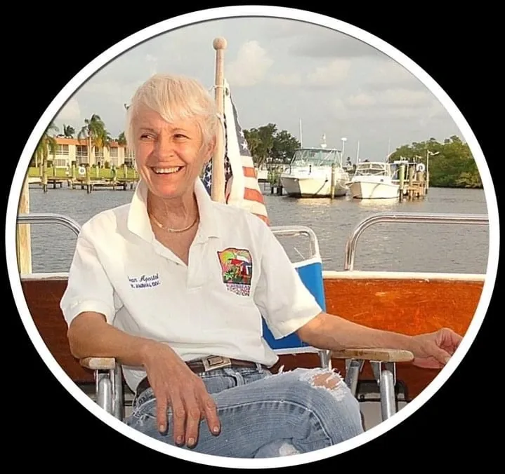 A woman sitting on top of a boat.